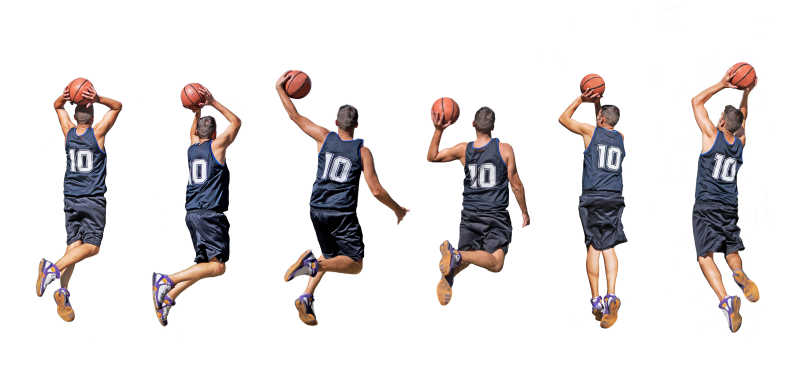一群篮球员在跳跃起身投掷篮球