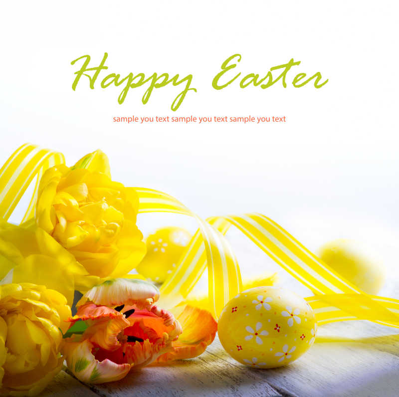 复活节彩蛋和黄色的花在白色背景下