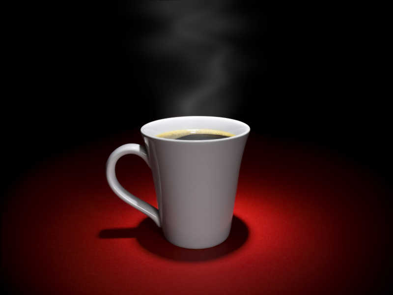 黑色背景下红色桌子上的一杯热咖啡