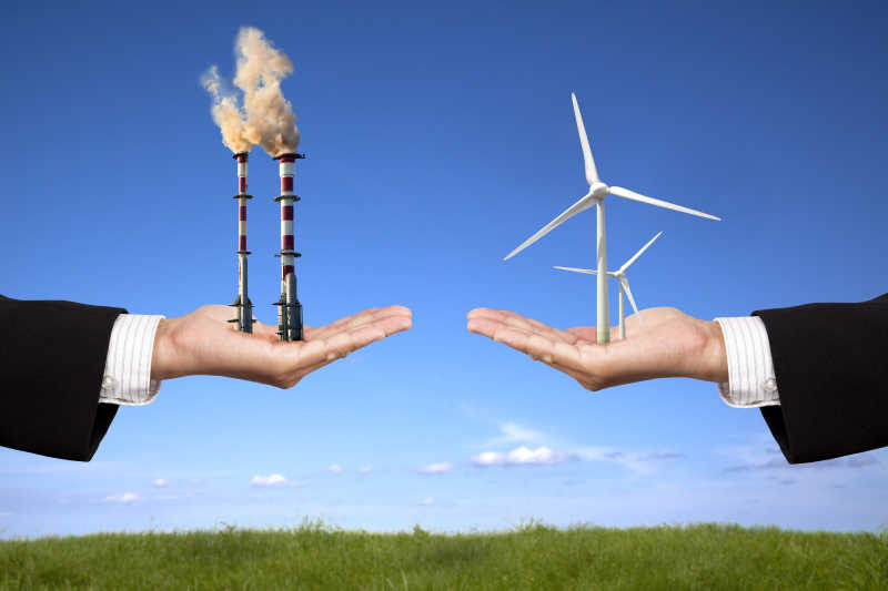 商人手里的工业污染与绿色风力发电机