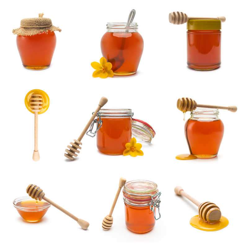 不同的蜂蜜罐和蜂蜜杓