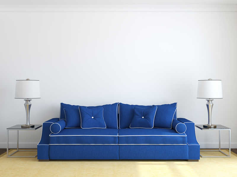 现代靠在墙壁上的蓝色沙发