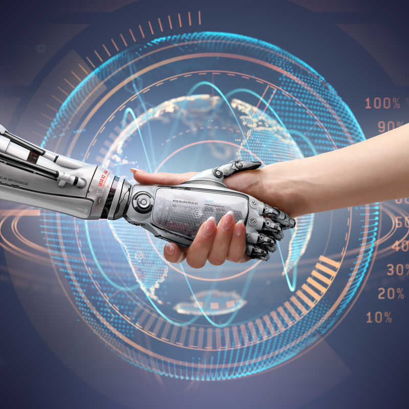 女人与机器人握手象征着人与人之间的联系和人工技术