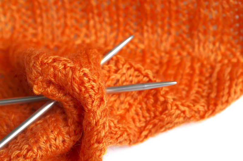 针织作品橙色纱缝线宏