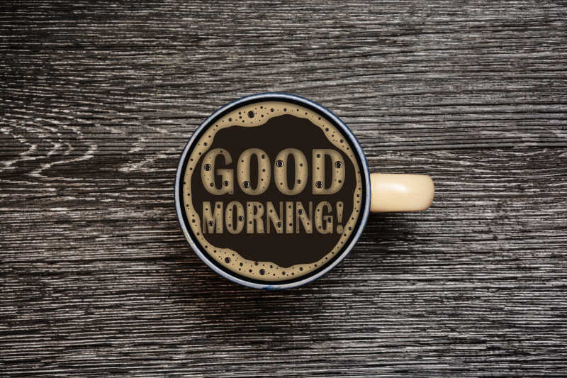 木纹理桌面上一杯咖啡带来的早餐概念