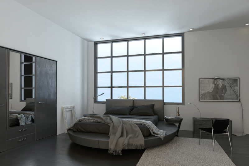现代卧室的床在巨大的窗户边
