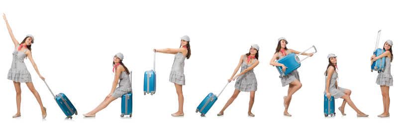 拿着蓝色行李箱外出旅行的女孩