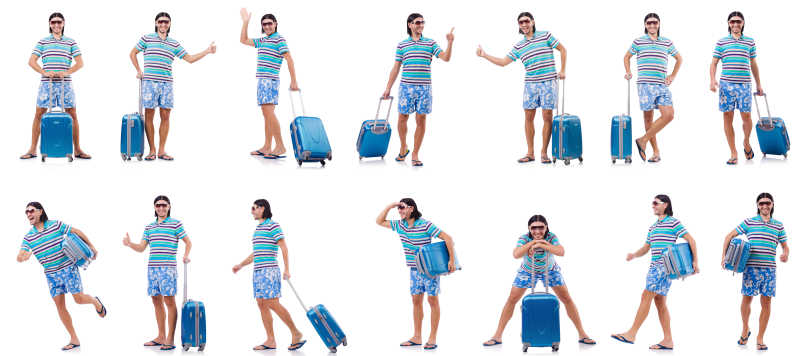 拎着蓝色行李箱的男孩