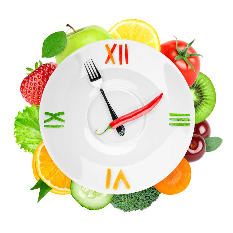 白色背景上的有健康果蔬的概念钟