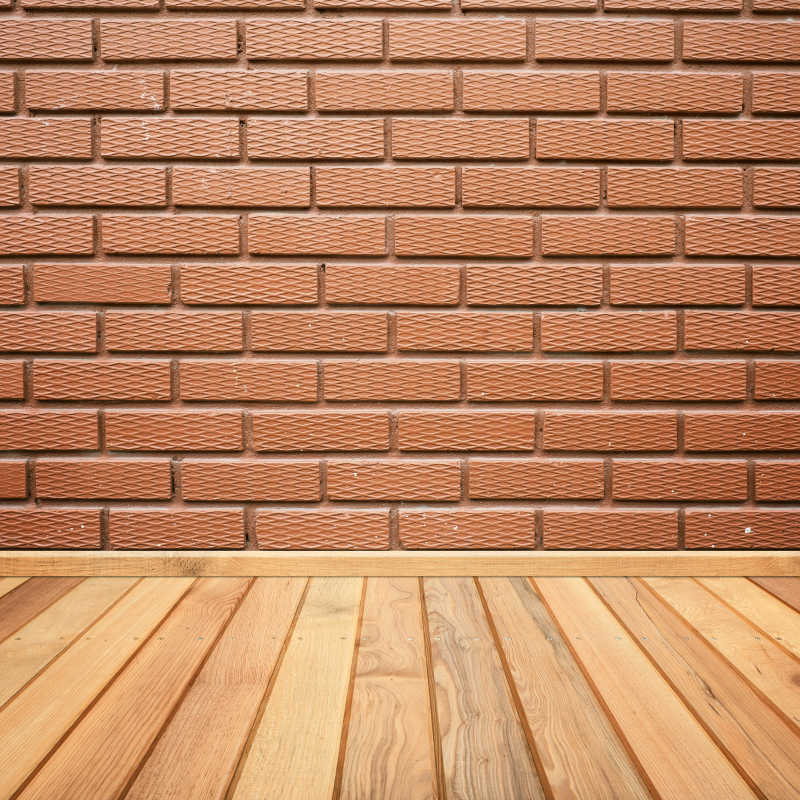 木质地板和纹理砖墙连接