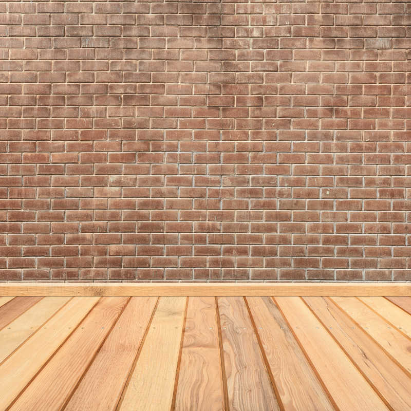 木质地板和砖墙连接背景