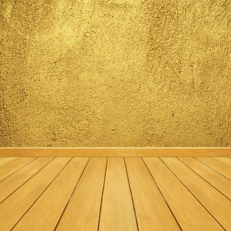 黄金木地板和墙壁相连接背景