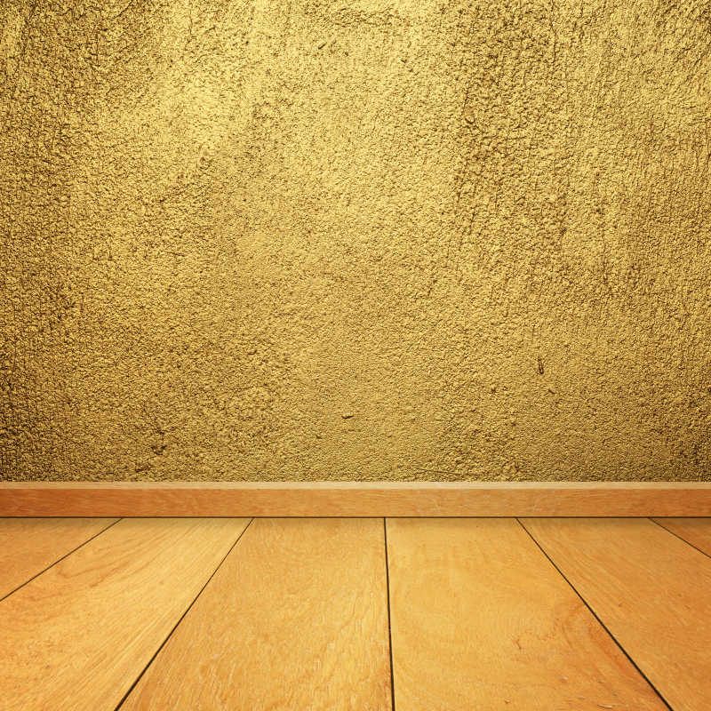 黄金混凝土墙和木地板相连接背景