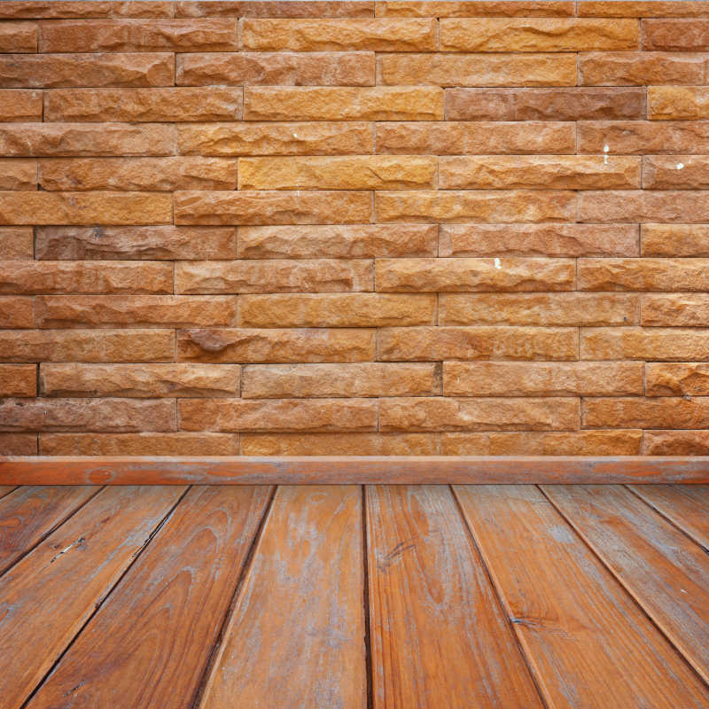 混凝土砖墙和木地板连接背景