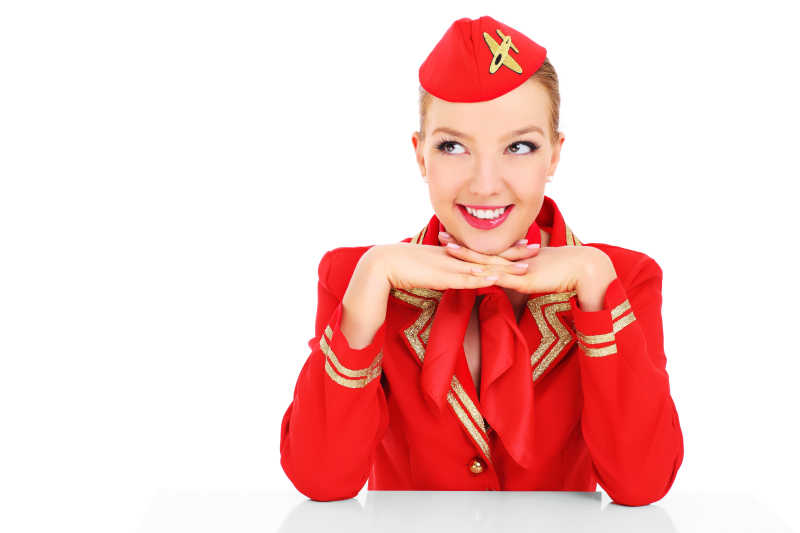 快乐的红色制服的空姐