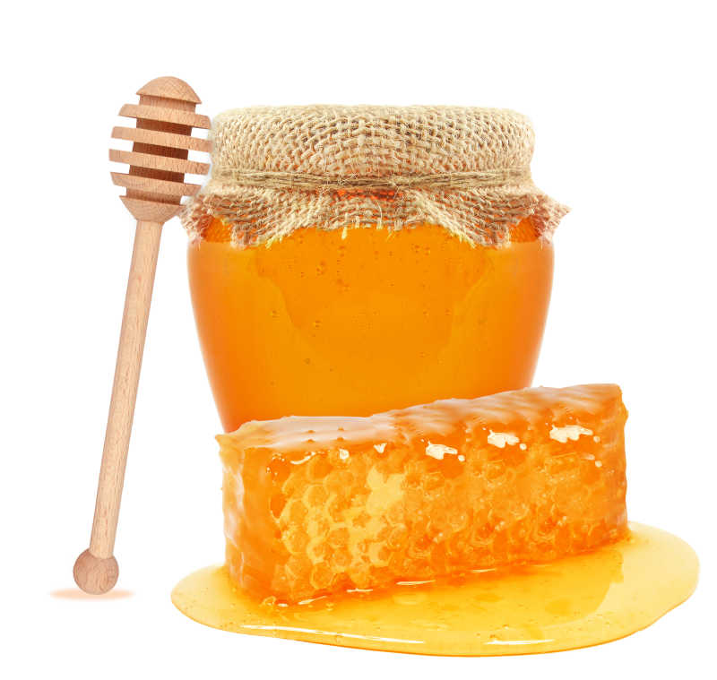 新鲜的罐子里的蜂蜜和外面的蜂窝