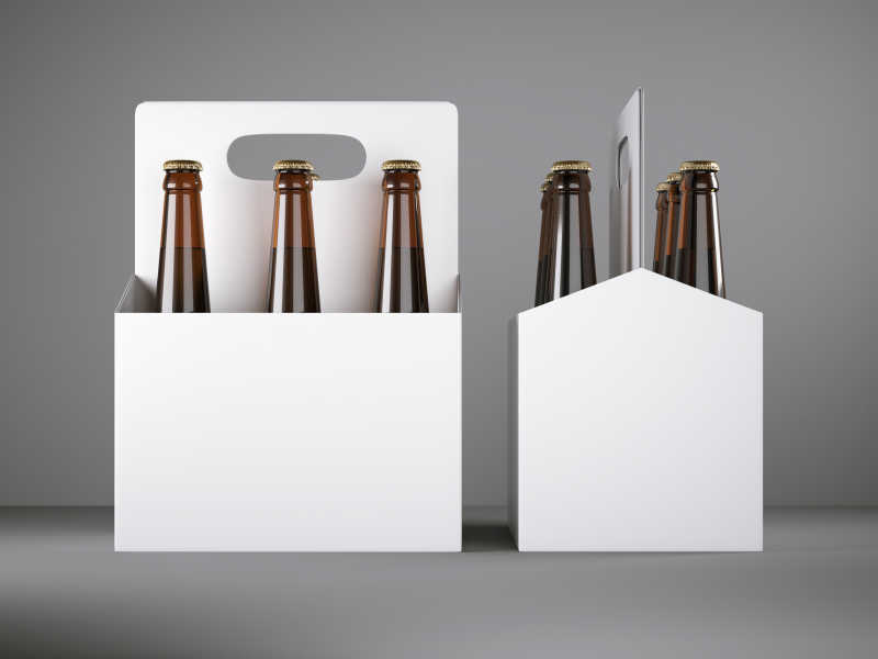 灰色背景下白色纸盒里排列放置的白啤酒