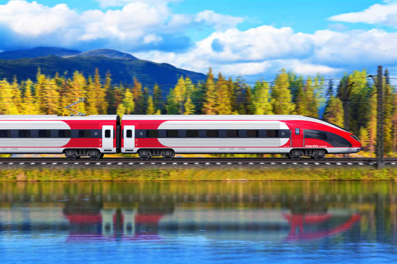 现代高速旅客列车在美丽的风景下高速行驶