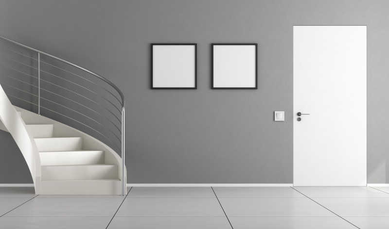室内灰色的墙壁白色的楼梯和闭门
