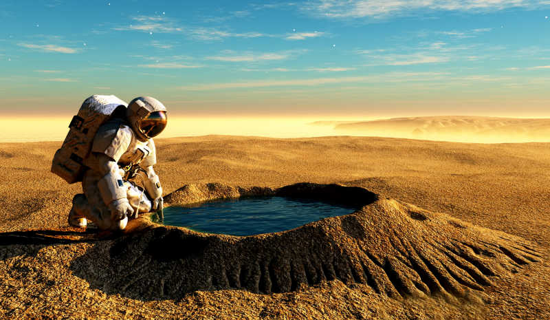 宇航员跪在水坑边