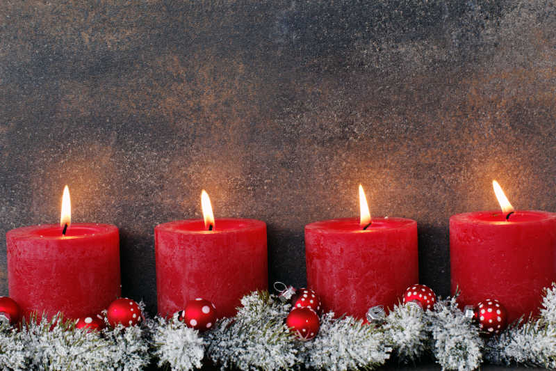 圣诞节红色的燃烧的蜡烛背景墙