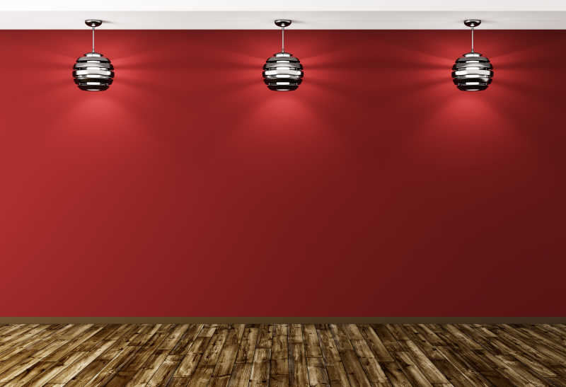 现代吊灯下的红色墙壁和木制地板