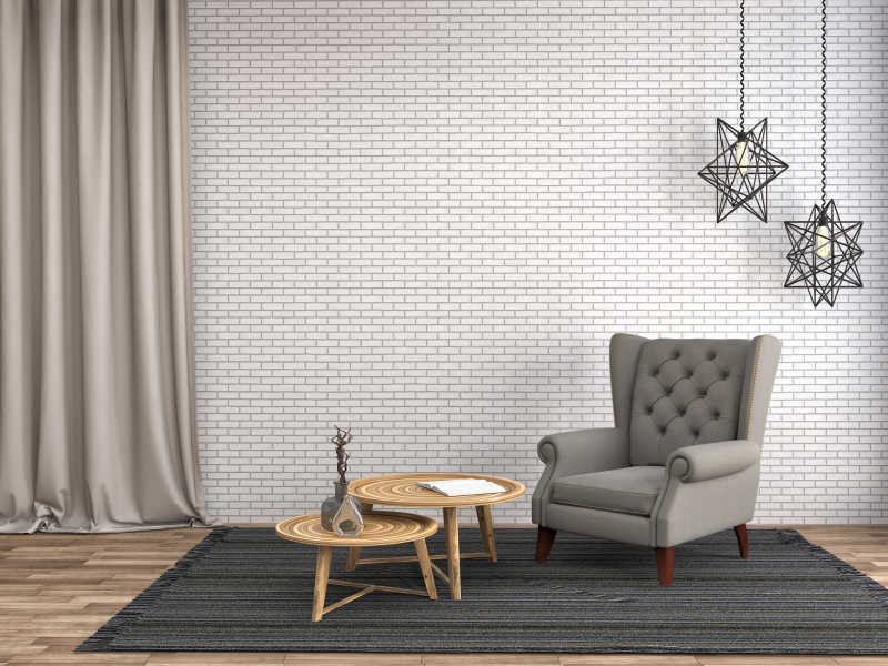 室内砖墙背景前的布艺扶手椅木质茶几和屋顶垂钓的五角星灯