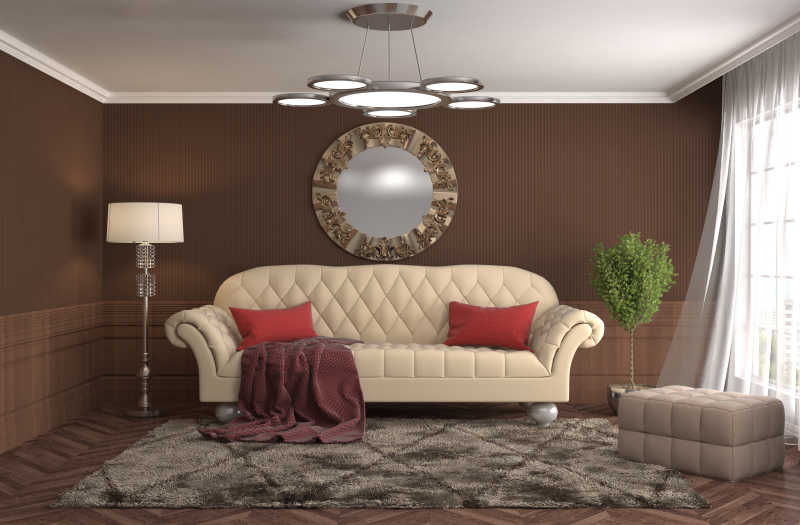 室内客厅皮质沙发后棕色背景墙上的圆型装饰和两旁的绿色和灯