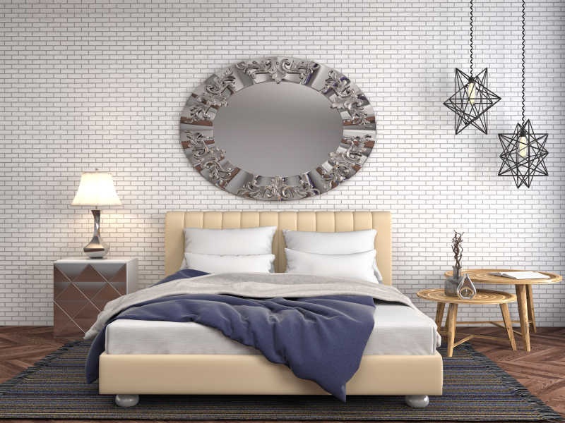 卧室内床后砖墙上的圆形装饰和床边的茶几台灯