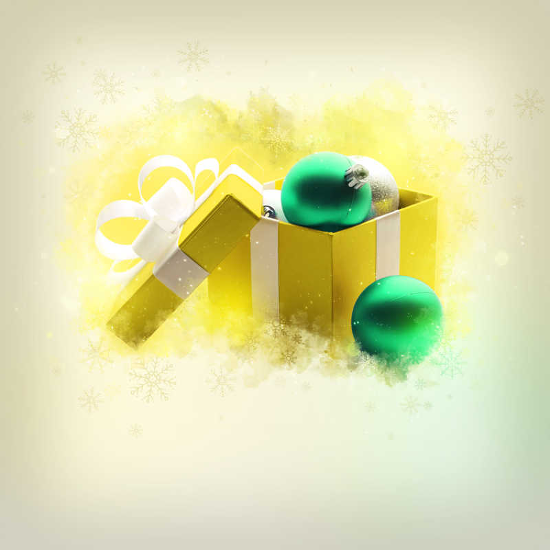 黄色礼品盒里的绿色装饰球