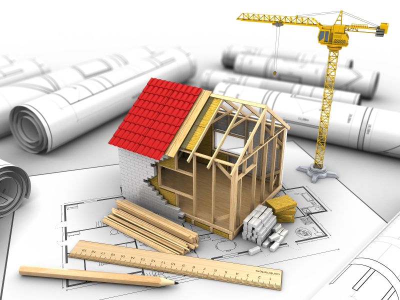 白色背景下房屋建筑框架模型与设计蓝图