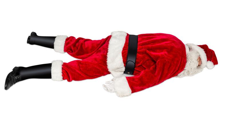 白色背景下躺在地上的圣诞老人