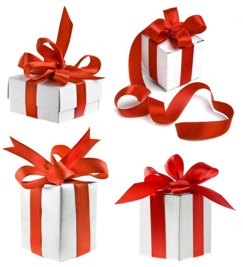 白色背景上的白色包装和红色缎带的礼品盒