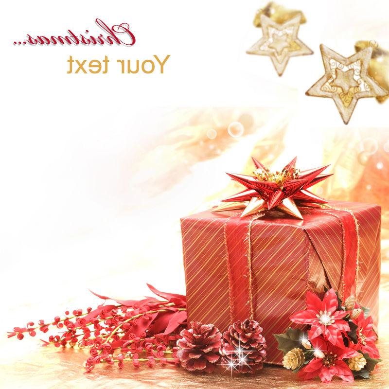 圣诞节黄白色贺卡背景下的圣诞节红色礼品盒