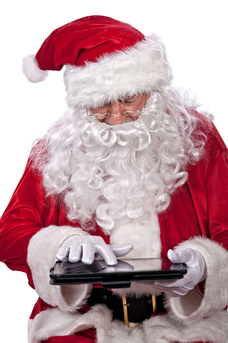 圣诞老人用手玩平板电脑