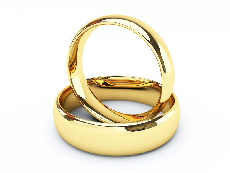孤立的金结婚戒指在白色背景上