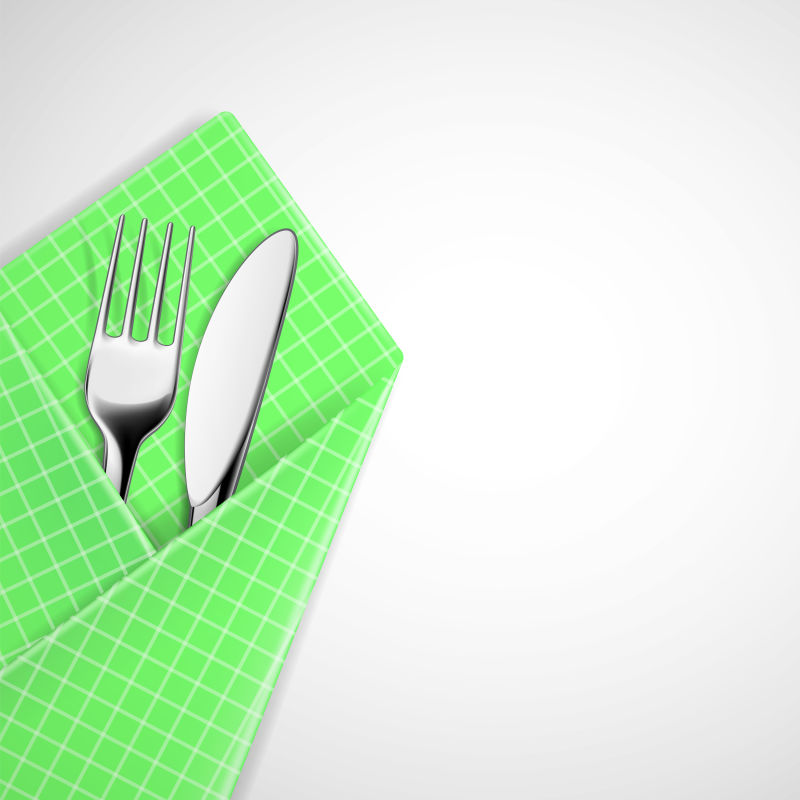 矢量绿色格子餐巾里的刀叉