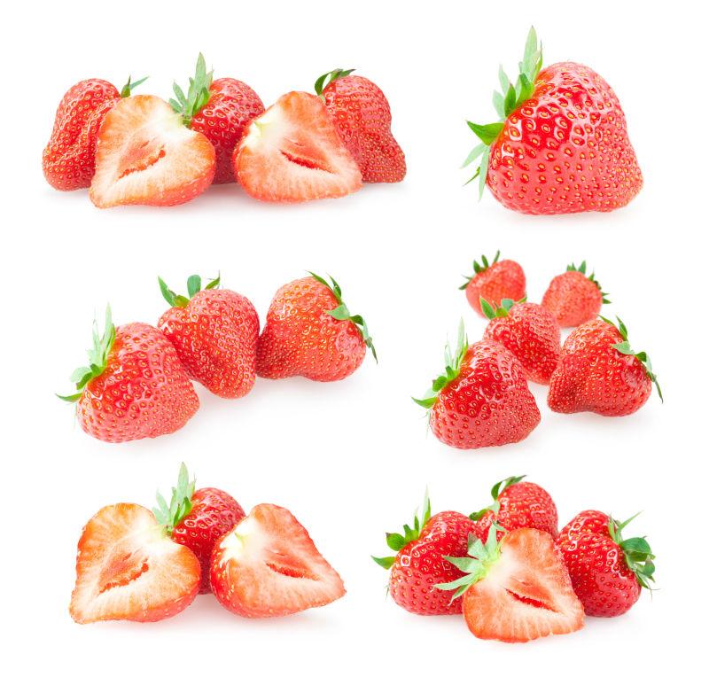 白色背景前的六组新鲜草莓