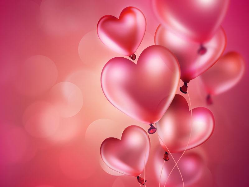 浪漫的背景粉红色的心型气球