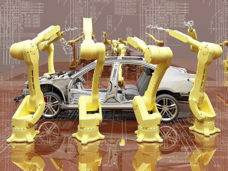 图纸背景下的机器人组装汽车
