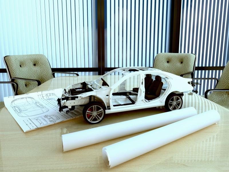 桌子上的模型车和图纸