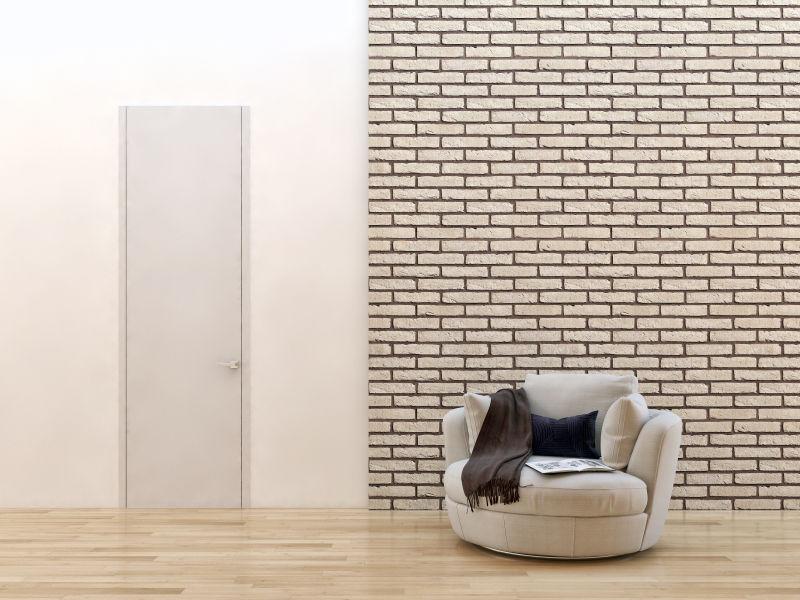 现代明亮客厅里砖墙背景下的沙发