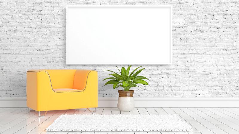 白色砖墙背景下的空白框架和黄色沙发
