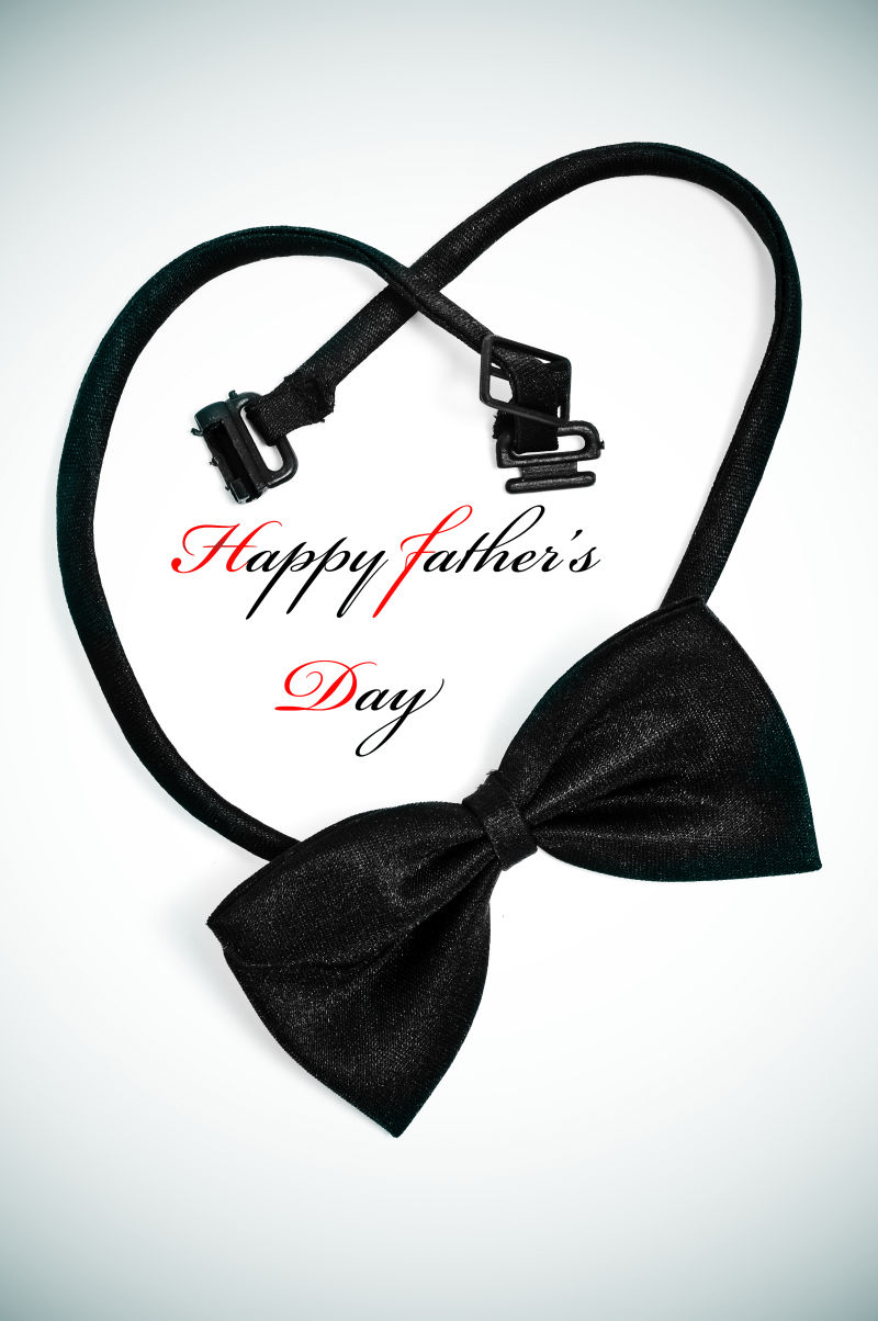 一个蝴蝶结形成一颗心和一句快乐的父亲节