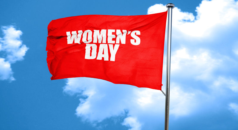 飞扬的旗帜上写着妇女节快乐