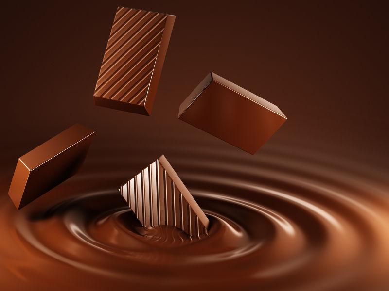 美味的巧克力块放入融化的巧克力中