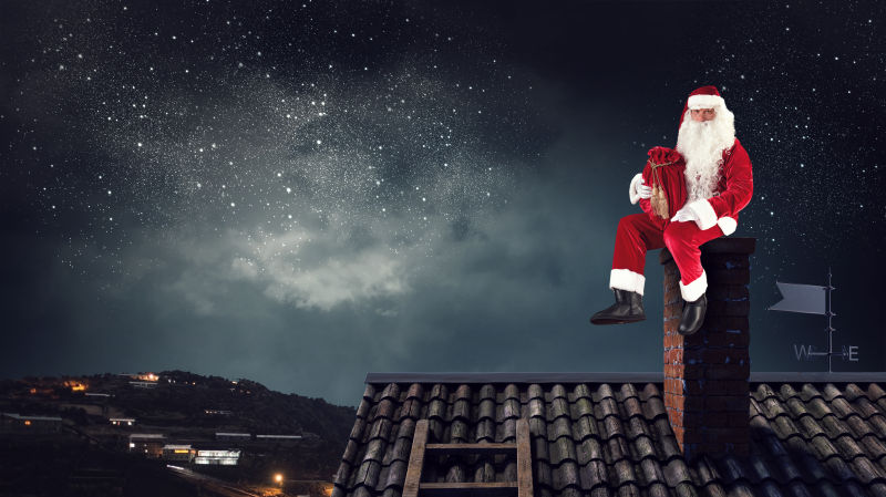 圣诞老人坐在屋顶