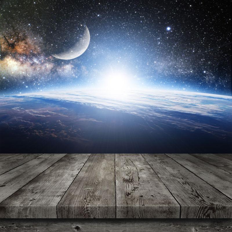 宇宙银河系星空背景前的木桌