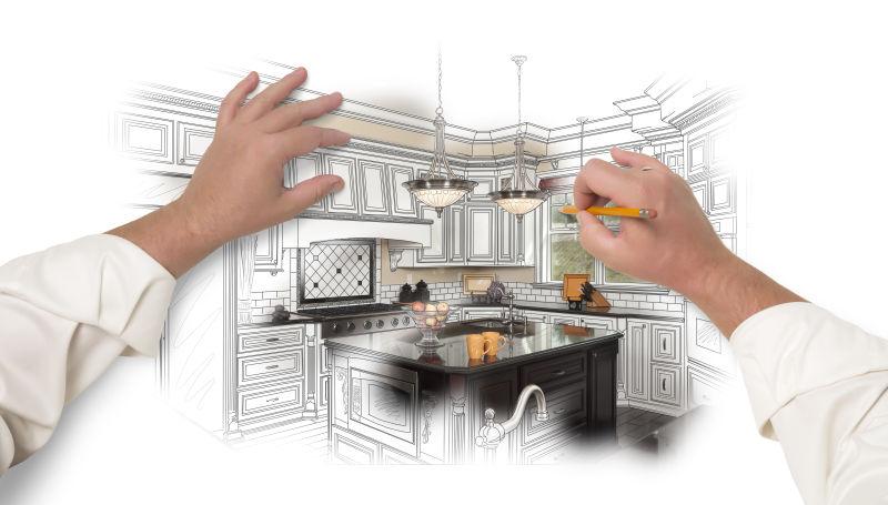 男手用铅笔画一个定制的厨房设计