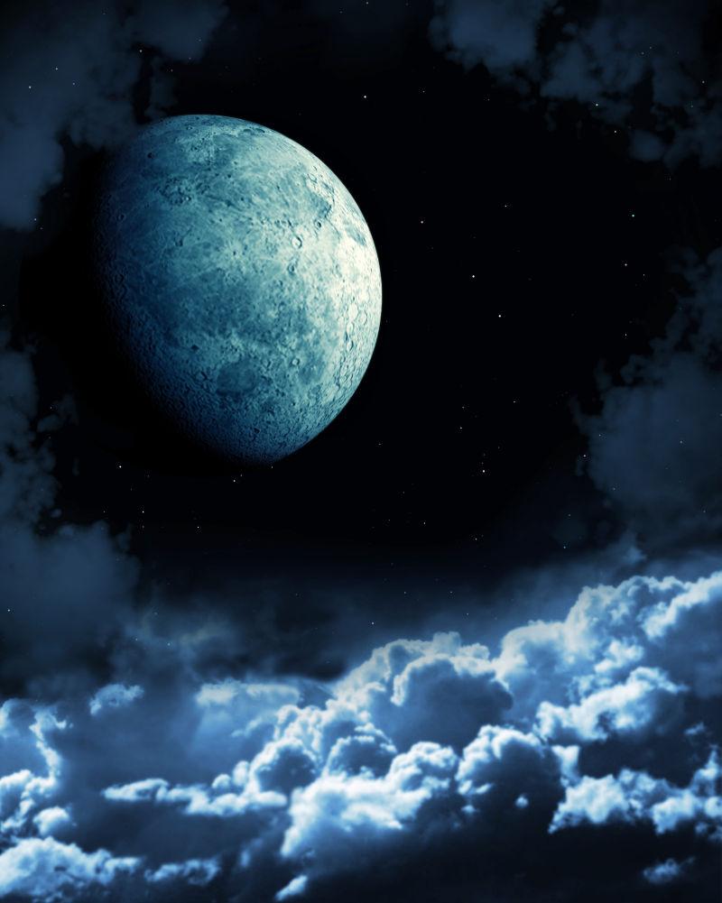 黑夜里云层上的圆月亮